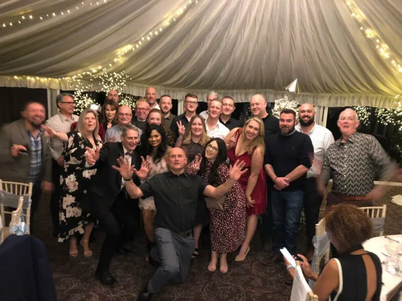 Staff members grouped together for a photo at their Christmas party