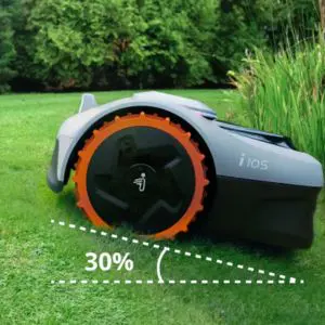 the Segway Navimow i105E Robotic Mower climbing a lawn with a 30% incline
