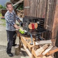 a man cutting logs using a horizontal log splitter