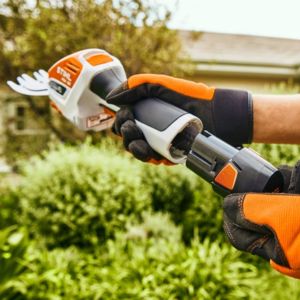 someone holding the STIHL HSA 26 Cordless Shrub Shears