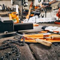 a selection of STIHL tools on a workbench, within a workshop