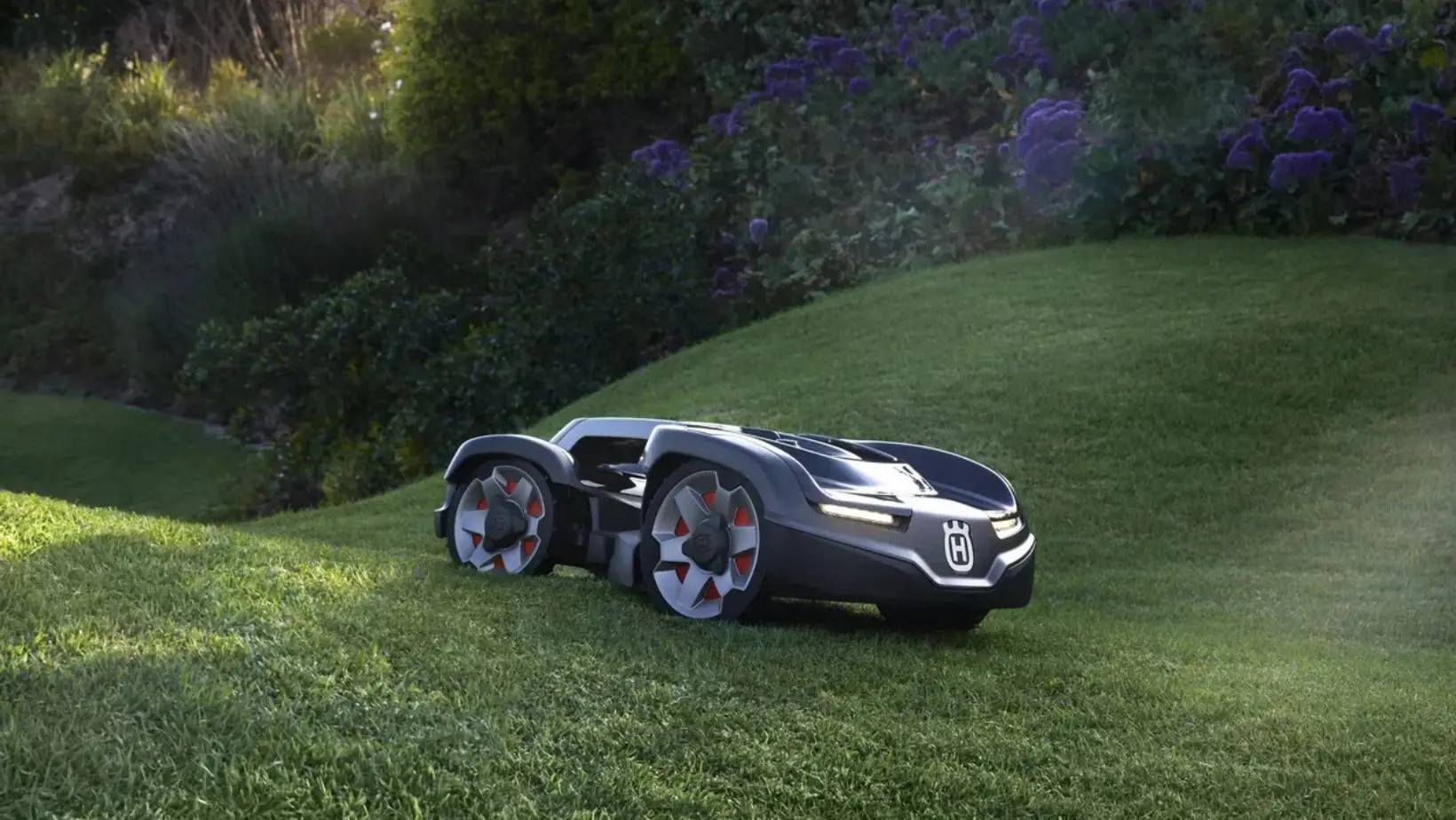 a Husqvarna Automower robotic mower mowing an undulating lawn