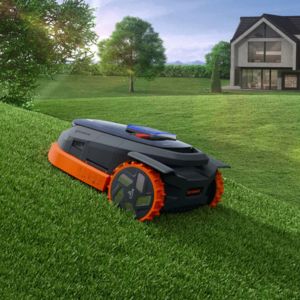 a Segway Navimow X3 Series robotic mower on a lawn with a steep incline