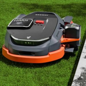 a close up of the Segway Navimow X3 Series Robotic Mower mowing a lawn