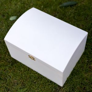 a white wooden garden storage box sat on a lawn