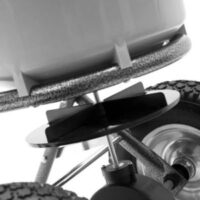 a close up of the impeller on a broadcast spreader