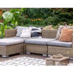 rattan garden furniture with grey seat pads and differently coloured cushions