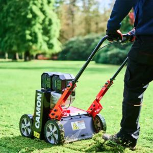 someone scarifying a lawn using the Camon ES42 EGO Cordless Lawn Scarifier