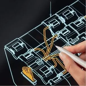 a close up of someone drawing a machine design