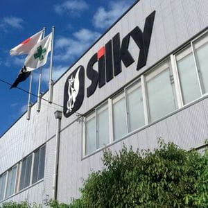 Silky Saws' HQ building, displaying the company's logo and flying 3 flags