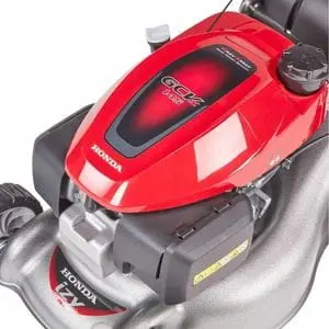 a close up of a Honda IZY mower's deck and engine, set against a white background
