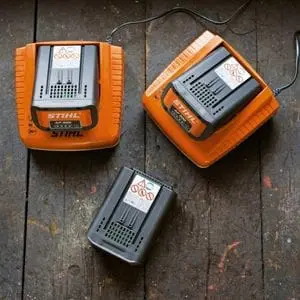 3 STIHL batteries, 2 of which are being charged