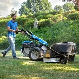 a man mowing grass using the BCS 740 PowerSafe® Two Wheeler Tractor